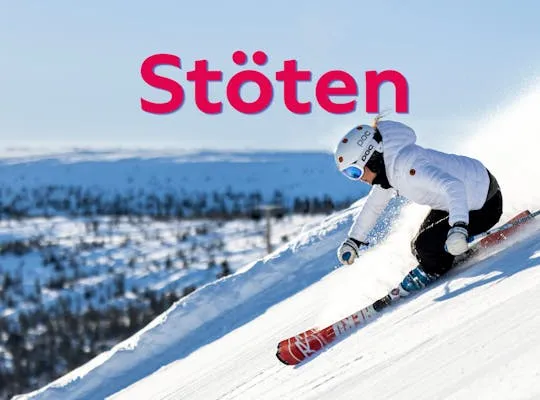 Billedet viser et vinterlandskab på pisten med en person, der står på ski